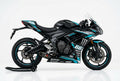 Triumph Daytona 660 cyan white decals on black paint side view